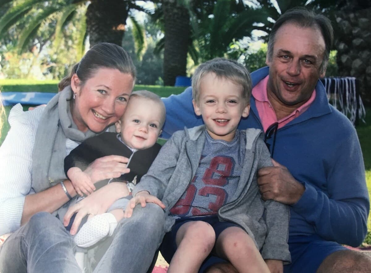 Christophe with his wife and their two children, in the garden